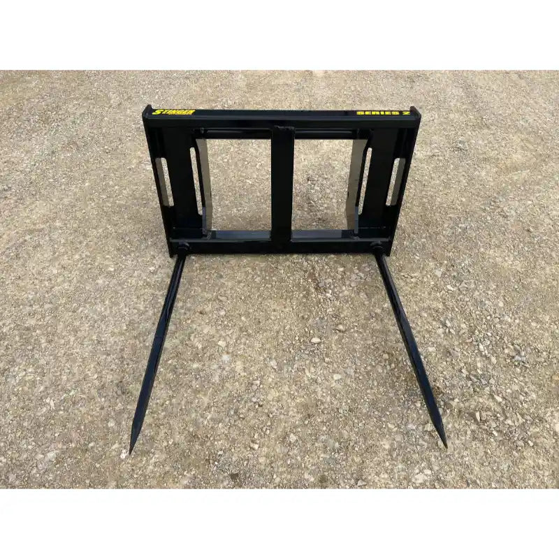 Stinger Attachments BS2-XD Series 2 bale spear with two long tines on gravel, gallery image 10 square 800x800