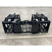 Black steel tractor grapple attachment with dual hydraulic arms, spaced tines, and reinforced side plates on concrete floor