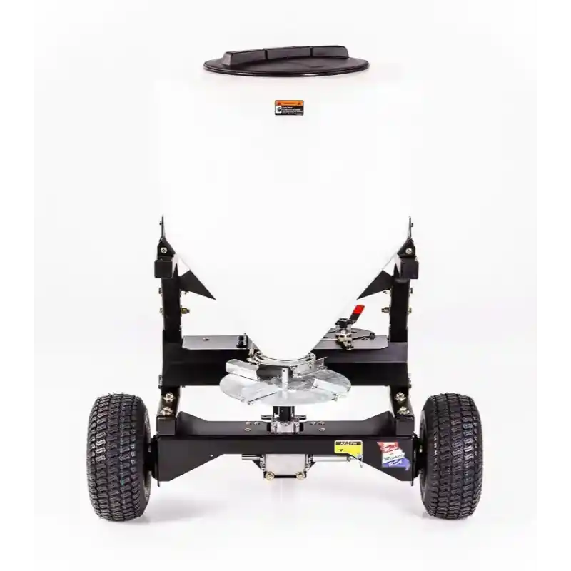 Front view of Swisher 52-Gallon Tow-Behind Spreader with white hopper, metal frame, dual pneumatic tires, and spreader disk, gallery position 1