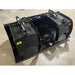 Black steel hydraulic grapple bucket attachment with dual cylinders and curved clamp arms on indoor concrete floor