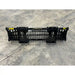 Black steel rock bucket skid steer attachment with spaced tines and dual mounting brackets on concrete floor