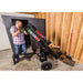 Man adjusting Swisher 22-Ton Timber Brute Eco Split electric log splitter inside unfinished wood-framed storage room, gallery 1