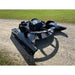 Stinger Attachments TF5 Twister skid steer brush cutter on gravel with green lawn background, gallery position 19