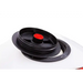 Close-up of black circular distribution plate and red center cap on white Swisher ATV spreader hopper, gallery position 1