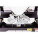Metal spreader disk and mounting assembly under white hopper on Swisher 52-Gallon Tow-Behind Spreader, gallery position 1