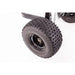 Close-up of knobby pneumatic tire and black steel rim on Swisher ATV Log Skidder, gallery position 1.