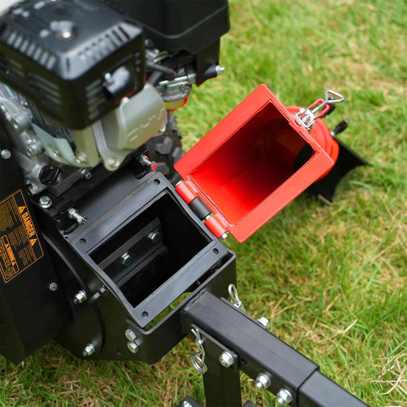 Close-up of MechMaxx GS650 wood chipper feed chute with open red safety cover and visible mechanical components, gallery position 1