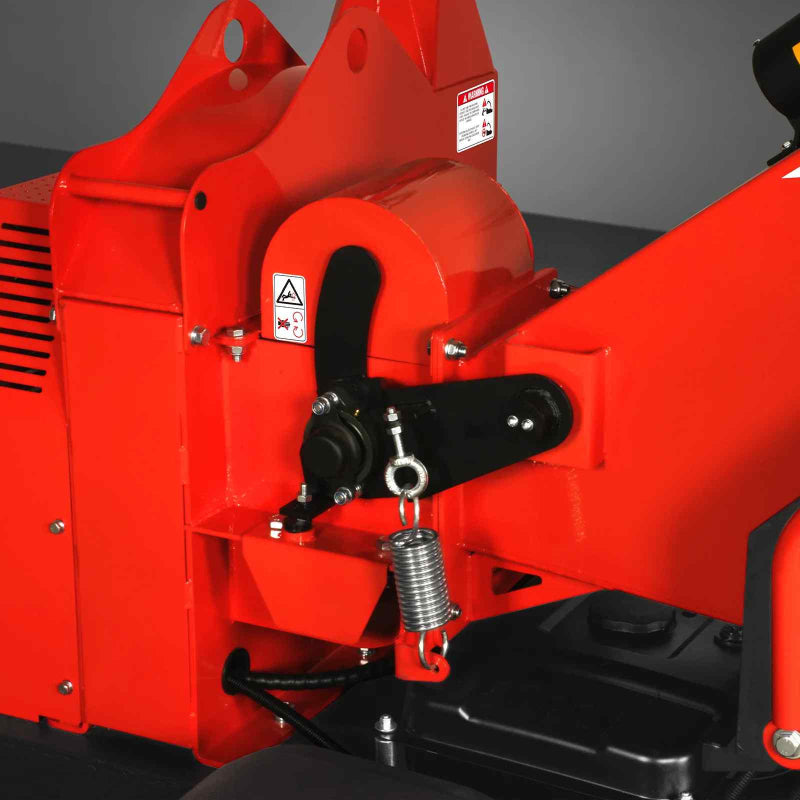 Close-up of mechanical linkage and spring assembly on MechMaxx 7-inch hydraulic feed wood chipper, gallery position 1