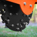 close-up of carbide teeth and metal flywheel assembly on orange MechMaxx SG30PRO 3-point PTO stump grinder at gallery position 1