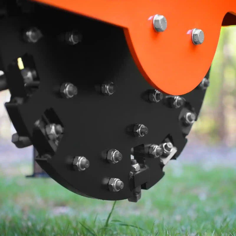 close-up of carbide teeth and metal flywheel assembly on orange MechMaxx SG30PRO 3-point PTO stump grinder at gallery position 1