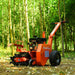 Three-quarter angled view of MechMaxx 7HP gas powered cable ditching mini trencher in forest clearing, gallery position 1