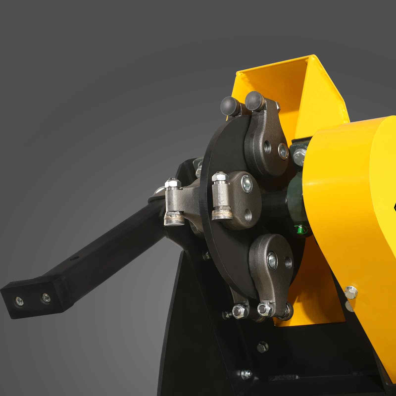 Close-up of hydraulic control arm and pivot mechanism on yellow MechMaxx 420cc stump grinder, gallery position 1