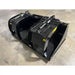 Black steel demolition grapple bucket with twin hydraulic cylinders and wide clamp arms on concrete floor indoors
