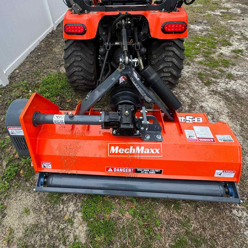 Rear view of orange MechMaxx 48-inch PTO driven light-duty flail mower connected to tractor, gallery position 1