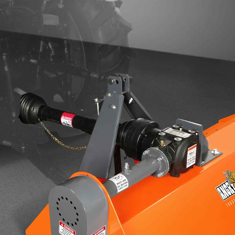 Close-up of PTO driveline and gearbox assembly on orange MechMaxx 68-inch flail mower, gallery position 1