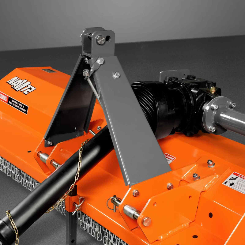 Close-up angled view of orange MechMaxx 72-inch PTO driven flail mower showing driveline and hitch mount, gallery position 1
