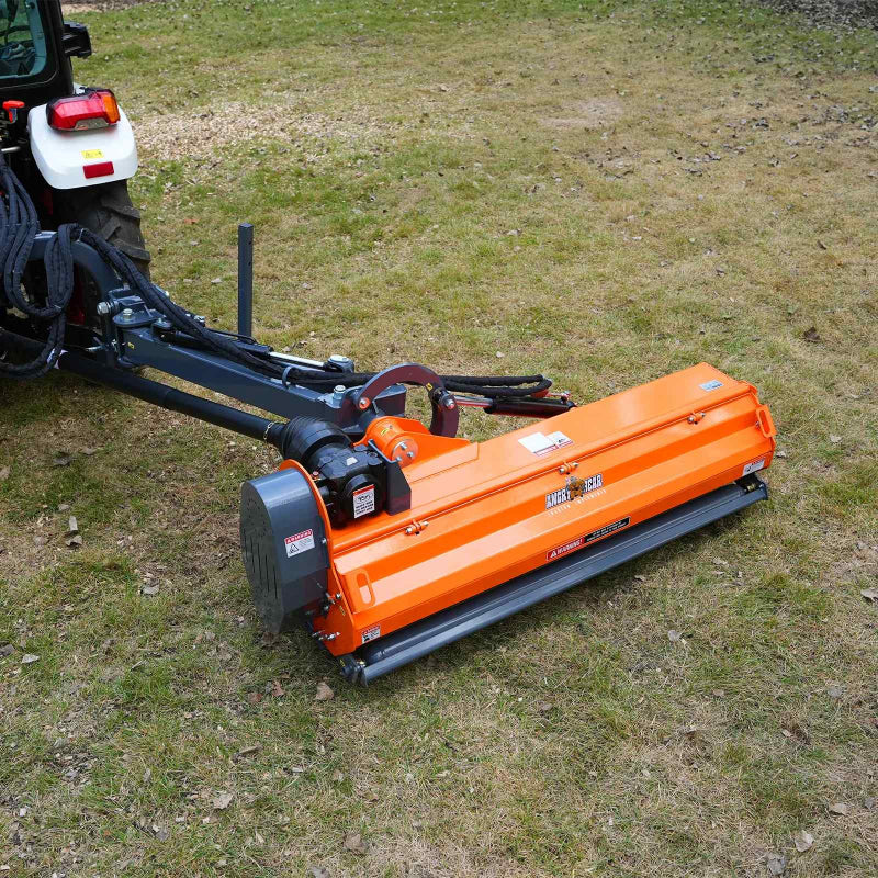angled close-up of orange MechMaxx 72-inch offset ditch bank flail mower connected to tractor boom at gallery position 1