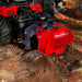 close-up angled view of red MechMaxx SG24 3-point PTO stump grinder attached to vehicle in forest setting gallery position 1