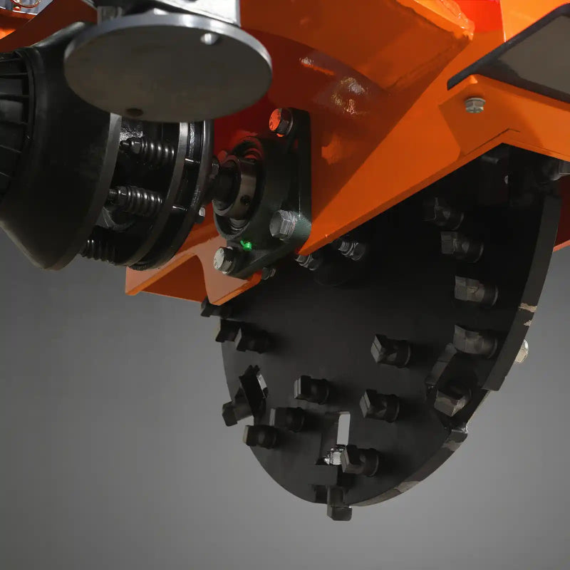 close-up of carbide teeth and drive assembly on orange MechMaxx SG24 3-point PTO stump grinder gallery position 1