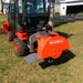 rear angled view of orange MechMaxx SG24 3-point PTO stump grinder mounted on utility vehicle gallery position 1