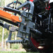 close-up of orange MechMaxx TSG61 hydraulic cylinders and mounting frame on stump grinder attachment gallery position 1