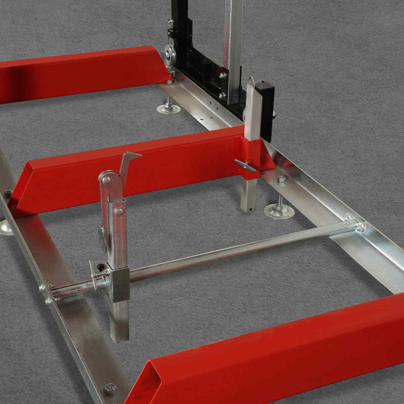 close-up of red MechMaxx 32 sawmill log clamp and metal frame components at gallery position 1