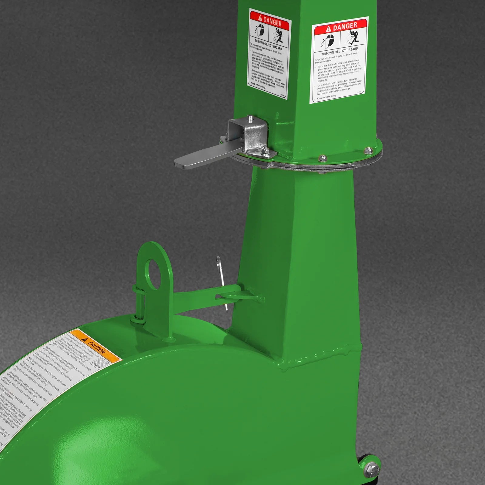 Green equipment attachment with tall housing, warning labels, metal latch, and curved lower body