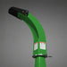 Green curved discharge chute with black top cover, metal fasteners, and safety warning labels