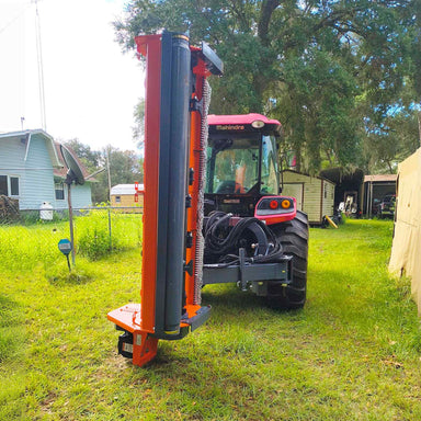rear view of tractor with vertical MechMaxx 78-inch 3-point PTO offset ditch bank mower at gallery position 1