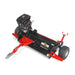 Red and black tow-behind rough cut mower with gasoline engine, wide deck, treaded tires, hitch, and height adjustment levers