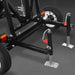 Black trailer frame with wheels, LED tail lights, and adjustable support jacks with square footplates