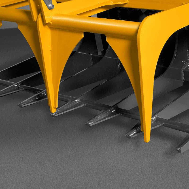 close-up of yellow MechMaxx 42-inch mini skid steer skeleton grapple tines at gallery position 1