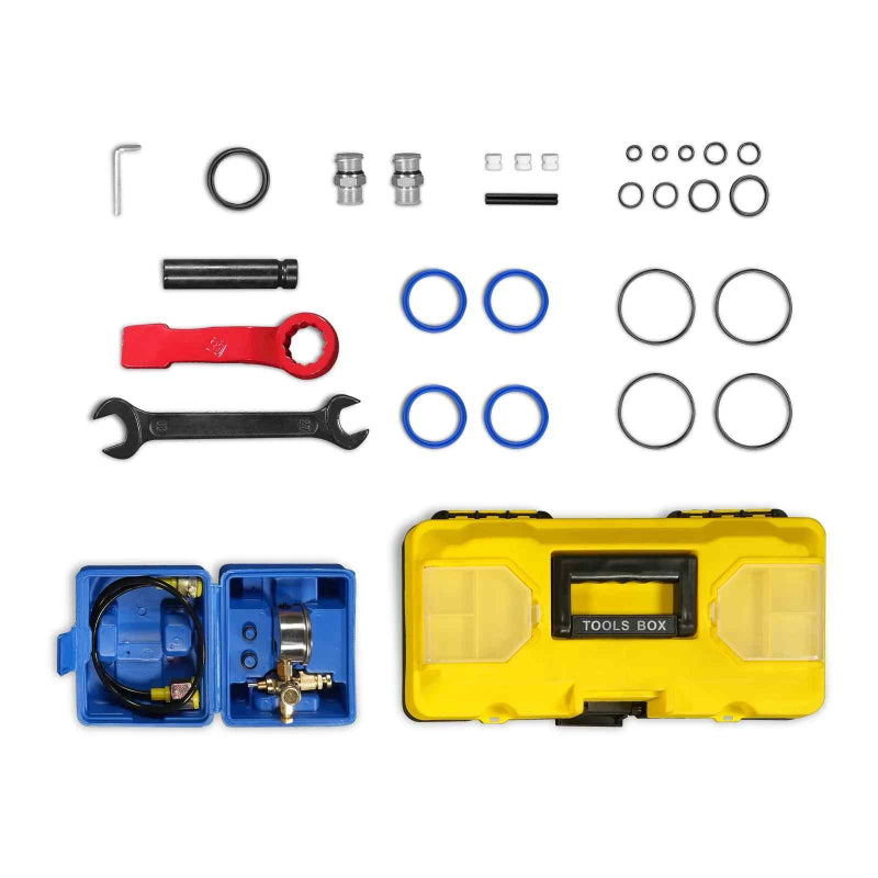 top-down view of yellow toolbox and assorted blue, black, red tools and seals laid out for MechMaxx breaker hammer gallery 1