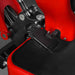 close-up on black foot pedal and hydraulic linkage assembly on red MechMaxx MEC10 mini excavator gallery position 1