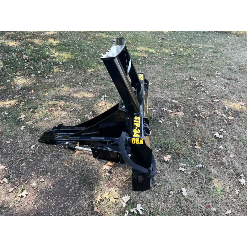 Stinger Attachments STP34 Tractor Tree Puller attachment resting on grass, gallery image 15, 800x800 square view