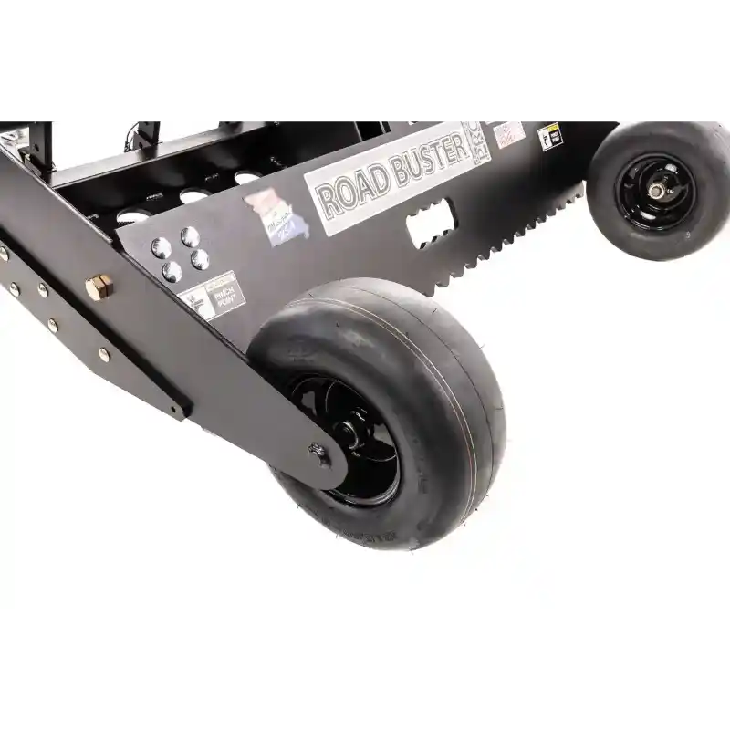 Close-up of Swisher 48" Driveway Grader front wheel assembly with smooth tires and serrated blade edge, gallery position 1