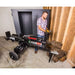 Gallery position 1 showing Swisher 22-Ton Timber Brute Eco Split electric log splitter with operator and stacked logs indoors