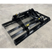Black steel skid steer land plane attachment with hydraulic hoses and mounting frame on concrete floor surface