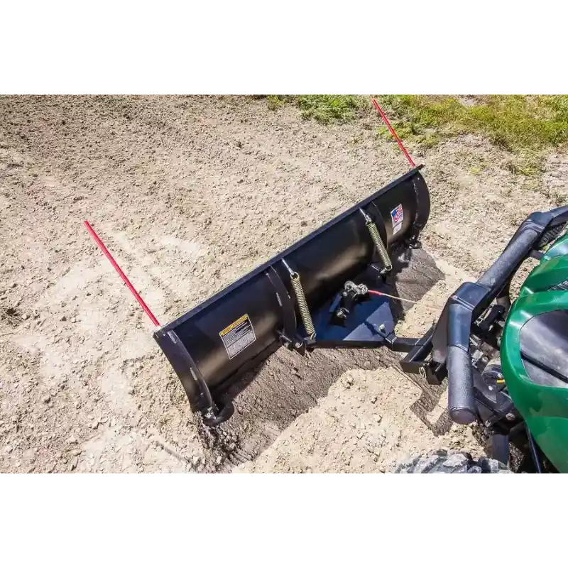 Black 62-inch Swisher angle plow attached to green UTV with springs and red visibility markers, gallery position 1