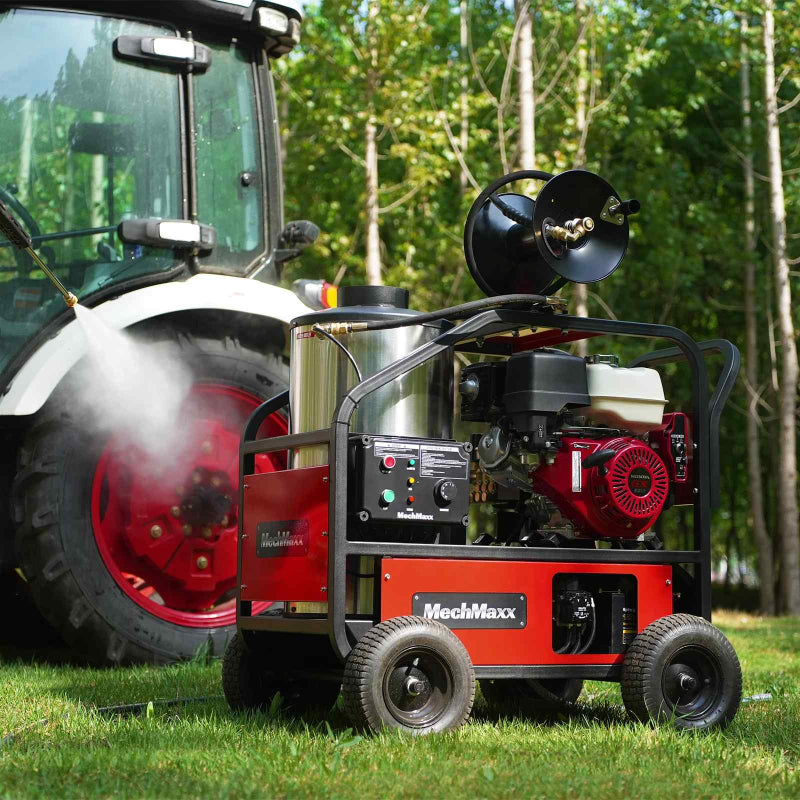 MechMaxx HPW40H hot water pressure washer with red Honda GX390 engine and hose reel on grass gallery position 1