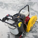 Gas-powered walk-behind concrete saw with yellow blade guard, red engine, white water tank, and black frame