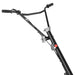 Close-up of black power trowel handlebar with control lever, adjustment knob, and throttle grip