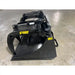 Black steel grapple bucket attachment with hydraulic arms and curved clamp claws on concrete floor indoors