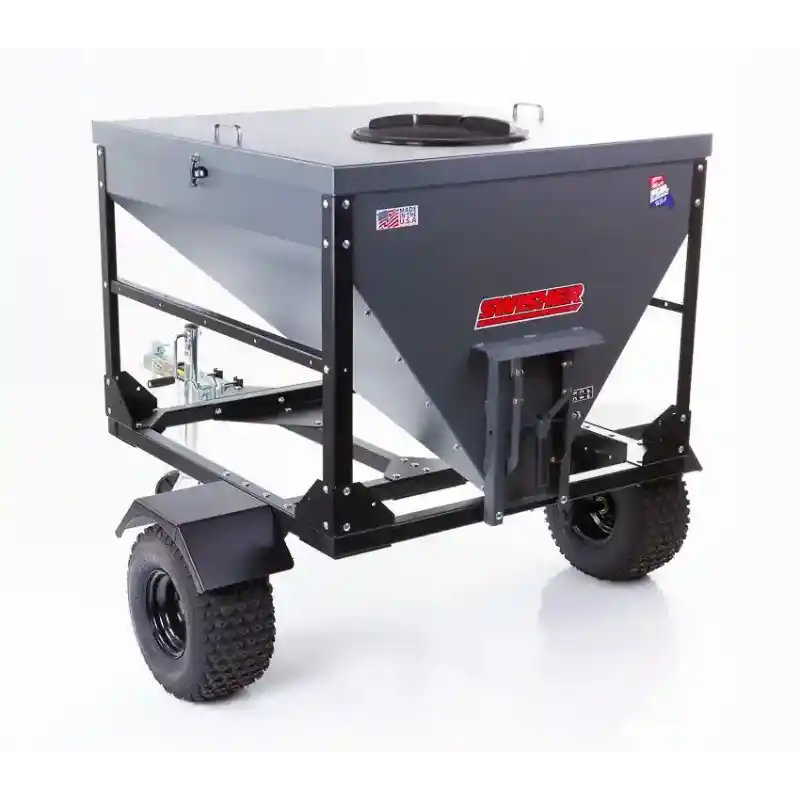 Swisher drop feeder with steel frame and dual off-road tires, access hatch on top, gallery position 1, isolated view