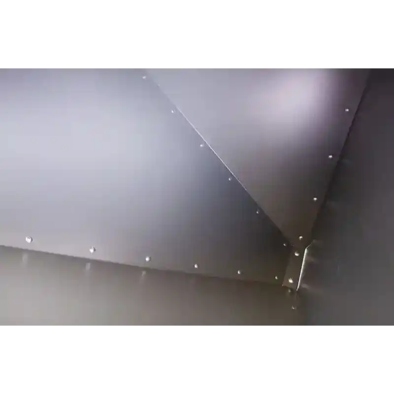 Interior close-up of riveted steel panels forming the hopper walls of Swisher Drop Feeder, gallery position 1