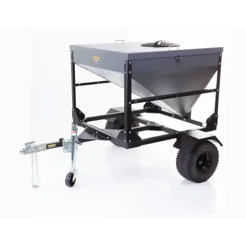 Swisher Drop Feeder with black steel frame, single axle, off-road tire, tow hitch, and top access lid, gallery position 1