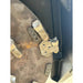 Close-up of metal disc mower blade teeth with mounting bolts on steel housing with some surface rust