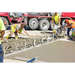 MBW Modular Vibratory Truss Screed leveling fresh concrete with crew wearing safety vests, gallery position 1