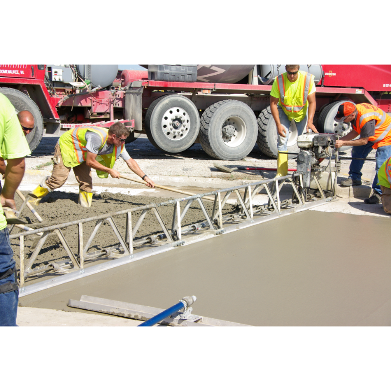 MBW Modular Vibratory Truss Screed leveling fresh concrete with crew wearing safety vests, gallery position 1