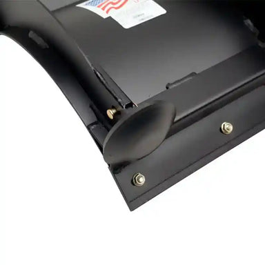 Close-up of black rolled plow blade edge with curved wing and mounting hardware, Swisher 50-inch, gallery position 1